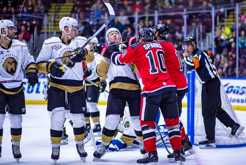 In this Oct. 18, 2019 file photo, Lindsay Sparks (10) of the Brampton Beast gets his stick up on Newfoundland Growlers captain James Melindy in front of the Growlers’ net during their game at Mile One Centre in St. John’s. The Beast, who were one of the Growlers’ most frequent ECHL opponents, and as such could be seen as an arch-rival, are folding operations and will not return to play for the 2021-22 ECHL season. — Newfoundland Growlers photo/Jeff Parsons