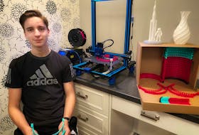 Caleb Anstey of Portugal Cove-St. Philip's is using a 3-D printer to produce parts for face shields that a company in Ontario is donating to hospitals and health-care providers. — CONTRIBUTED PHOTO 