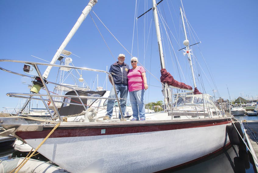 Ted and Patricia Haight on board Xcelsior II, a 44-foot sailboat at the Dartmouth Yacht Club.