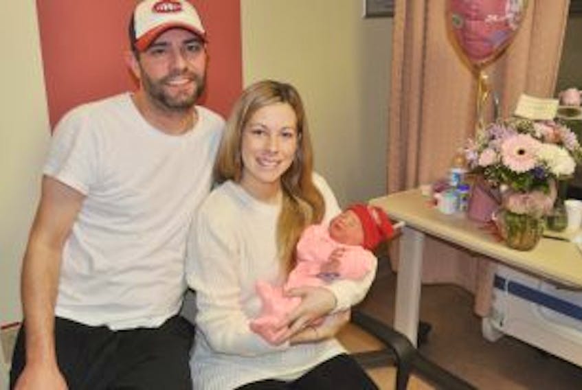['Chris and Heidi Connors hold their newborn baby Blake Annarielle Connors.']
