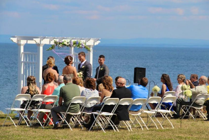 The Pictou Lodge is a busy wedding destination this summer. Here, a couple enjoys a seaside wedding Thursday afternoon and other weddings are booked throughout the weekend.