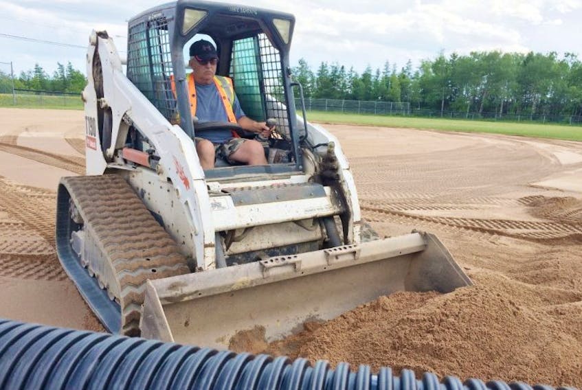 Howie Hennigar of JimHow Digs Dirt works on the infield of the Evansville Ballfield on Monday. The two fields, including the Rick Crowe Memorial Field, located in the Evansville area of Stellarton, are receiving upgrades. 