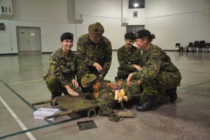 Members of the Nova Scotia Highlanders demonstrate their first aid skills at the Pictou Armoury – this will be one of several demonstrations to take place on a tour of the armoury, on Sept. 30.