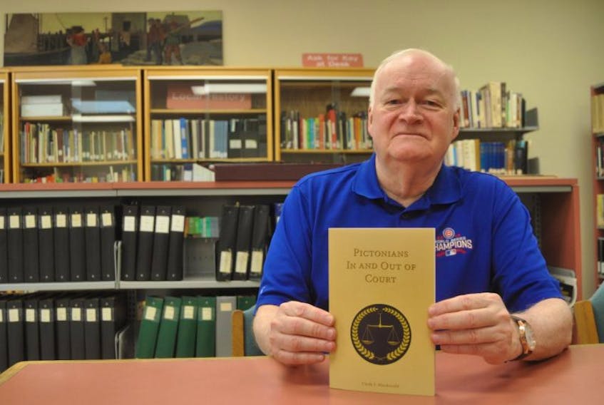 Clyde Macdonald holds a copy of his latest book, Pictonians In and Out of Court. He will be releasing it on Aug. 12. 