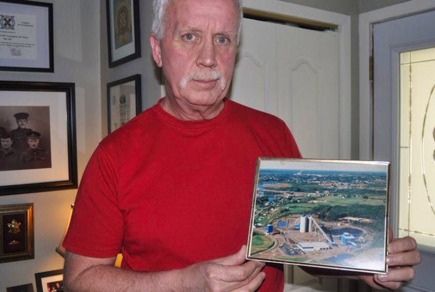 Ronald Cunningham holds a picture of the Westray mine. On May 9th, he will remember the friends he lost.