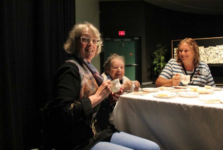 Margaret Nicholson shares tea with her mother Rita, middle, and Valley View Villa recreation programmer Kim Fraser before the opening of The Life of Jean. 