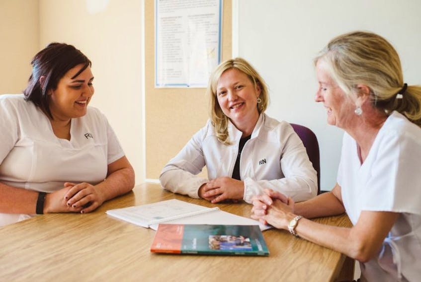 Carla MacDonald, clinical nurse specialist (centre), is joined by some of the Best Practice champions in her department at the Aberdeen Hospital, RNs Brittany Heighton (left) and Sandi Kennedy (right).