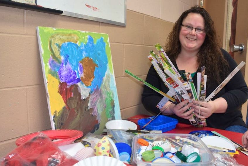Library assistant Sandria Crosby is pictured with some of the materials being used for a ‘Junk Art’ session.