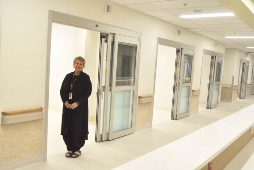 Brenda Payne, director of acute care for the Department of Health, stands next to new rooms where doctors will see patients in the Aberdeen Hospital’s newly constructed emergency department. It is expected to open in the fall.