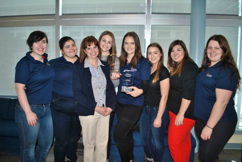 NSCC Pictou campus Enactus members Sam MacKenzie, Jennifer MacLellan, Emma Spaulding, faculty adviser Anne McDonah, Holly Klein, Bethany Ripoll, Nicole MacDonald and Maddie Fleming are shown with the two awards they received from the 2017 Scotiabank Ecoliving and Empowerment regional challenges. Missing from the photo are group members Sydney DeBay, Kelyn Palmer, Hailey Conley and faculty adviser Jim Bate.