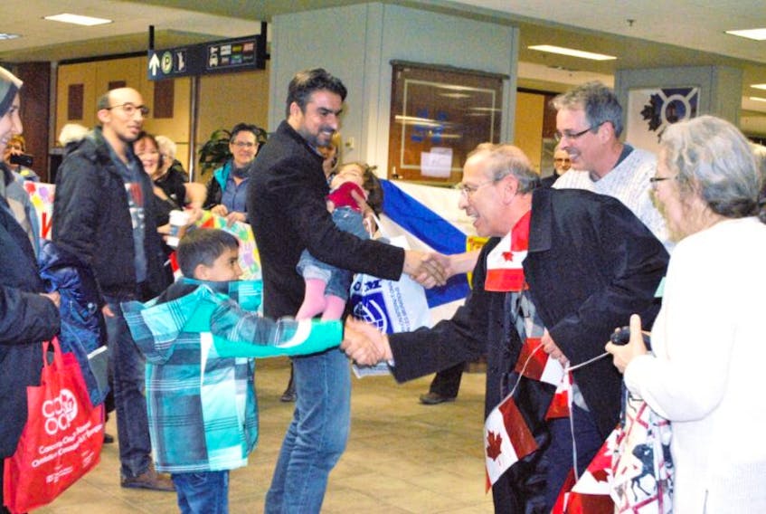 Members of CAiRN welcome the Casim family at the Halifax Stanfield International Airport last year. The group is hoping to greet another refugee family soon.