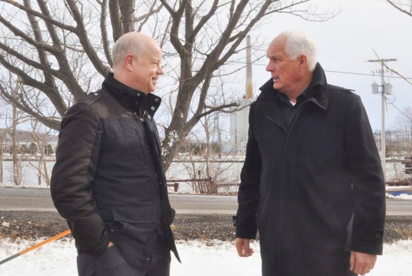 Pictou Centre MLA Pat Dunn and PC Leader Jamie Baillie talk outside Hawboldt Machine Shop in Pictou County Friday. 