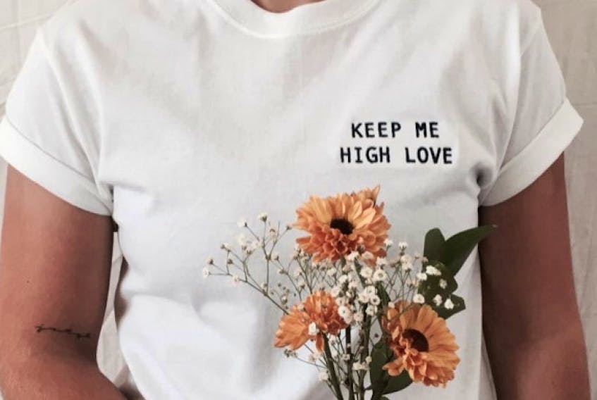 The simple message that started Me Before You Clothing is pictured on one of the company’s T-shirts. Rhiann MacDonald, originally from New Glasgow, and partner Vanessa Hamkens created the clothing line earlier this year.
