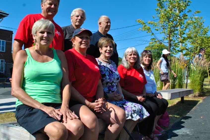 Eight of Stanley Dudka’s 12 children gathered on Saturday as a bench was dedicated to their father at the Stellarton Town Square. Shown, from left, sitting on the bench are Helen Johnson, Sonya Dudka, Alicia Dudka, Kathy Dudka, Judith Haggerty; in back: Stephen, Tom and Bernie Dudka.