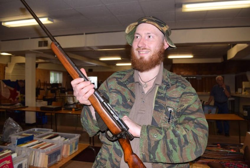 John Rae is shown with a British-made First World War-era rifle on Saturday.
