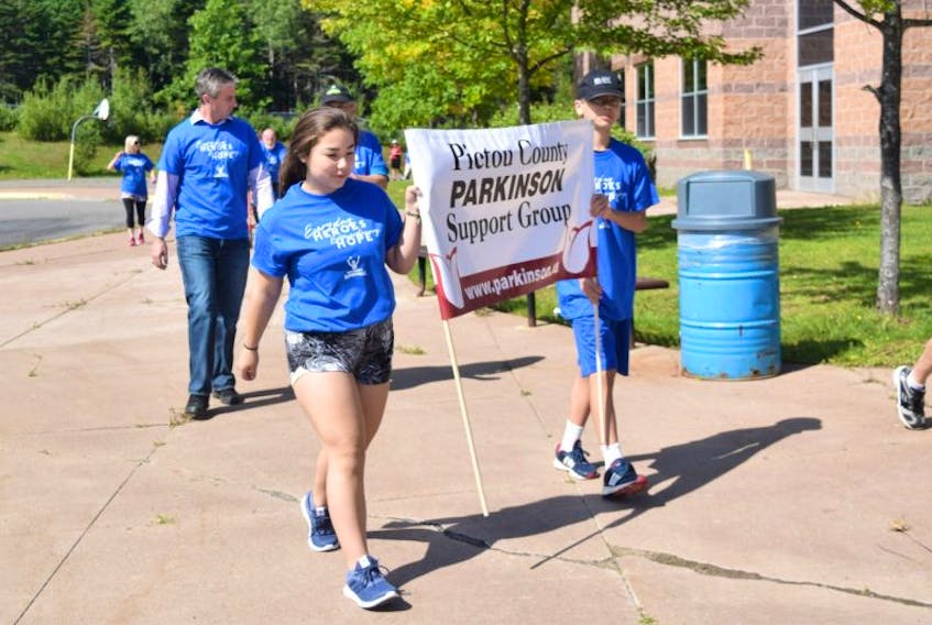 Josey and Ryan LeBlond lead the several dozen walkers who took part in Parkinson’s Superwalk on Saturday at Northumberland Regional High School.

