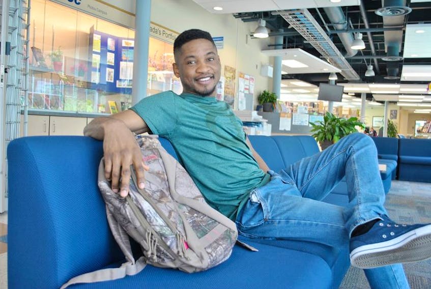 AJ Ibe-Diala relaxes at the Pictou campus of the Nova Scotia Community College a few days before his graduation.