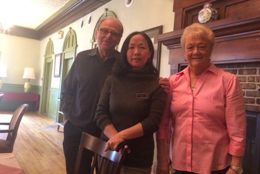 Mike and Anne Emmett are officially enjoying retirement after selling the Braeside Inn to Linda Qian, centre. Qian has opened the inn for accommodations, but is planning its official opening in July and will include dining room service. 