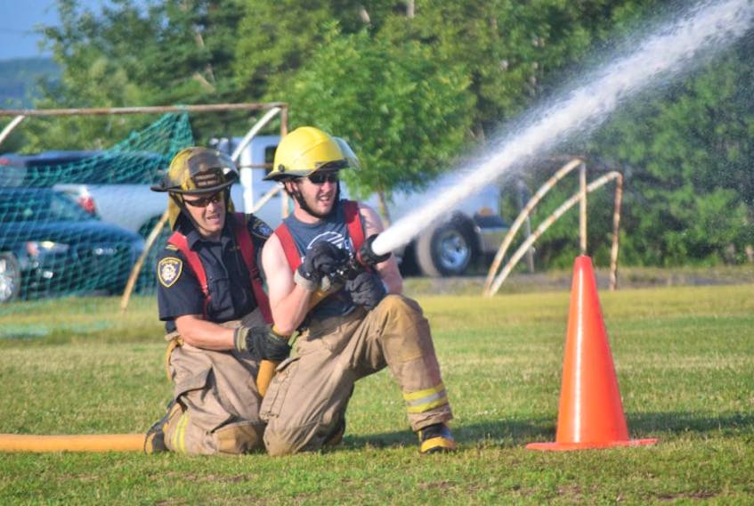 Firefighters participate in the Firemen’s Competition during last year’s Stellarton Homecoming.
