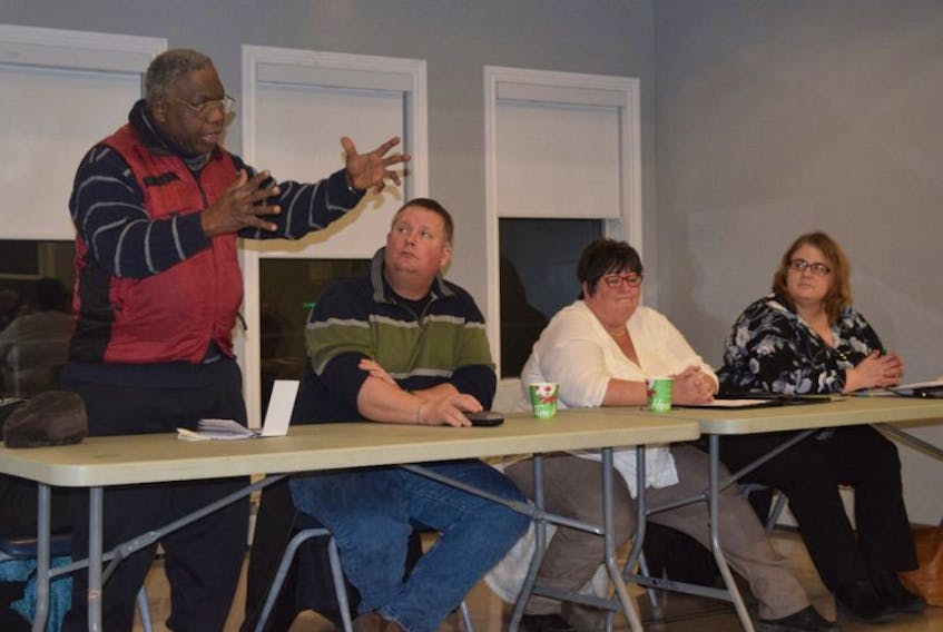 Addressing a crowd of more than 30 at the North End Recreation Centre on Friday are from left are Rev. Moses Adekola, Paul Vanderlaan, Karen MacPhee and Vania MacMillan.