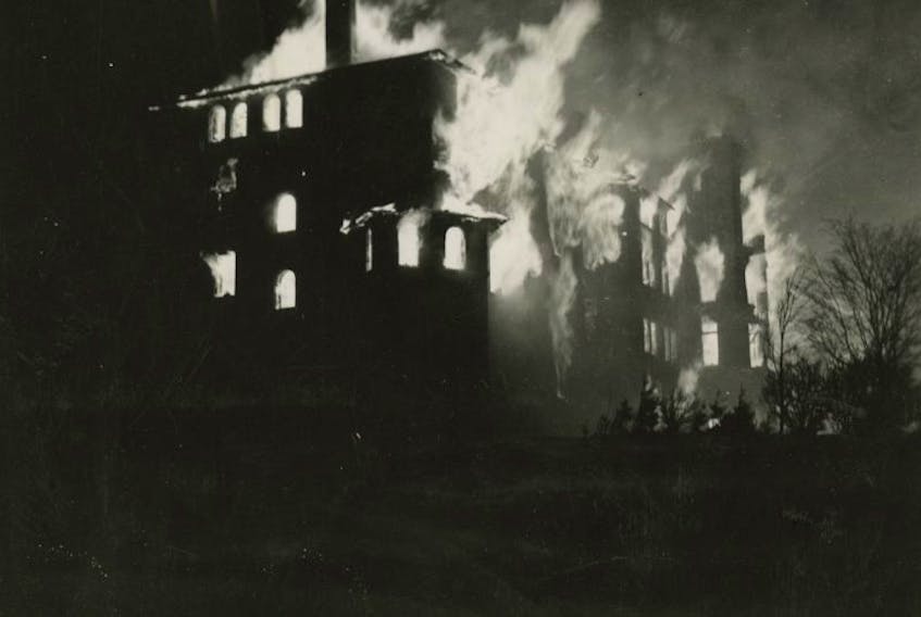 The Mount Allison men’s residence is engulfed in flames on Dec. 16, 1941.