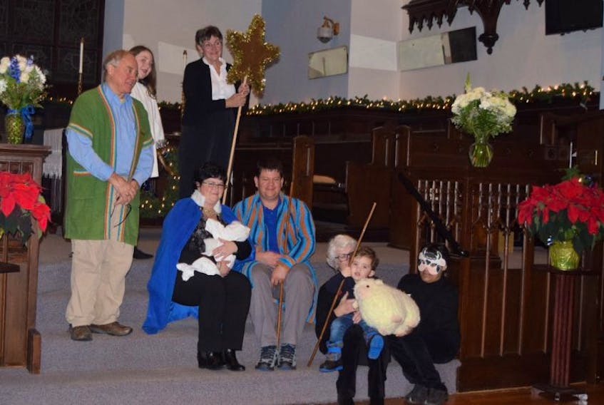 Cast members gather after a Christmas pageant was performed Tuesday at Trinity United Church in New Glasgow.