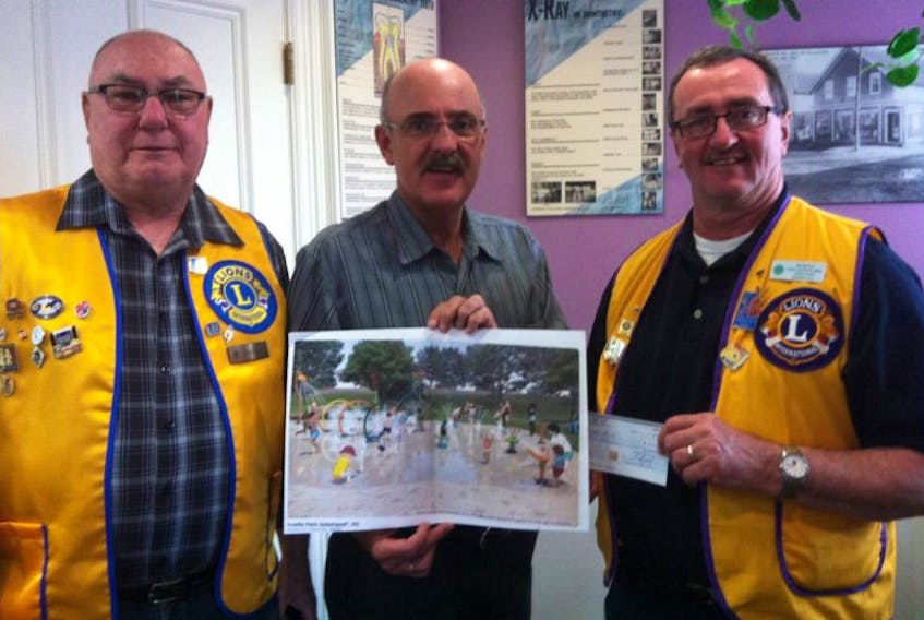 Stellarton Lions Club members Bob Buell and Joe Doyle with a $2,500 donation presented to Dave Dignan. 