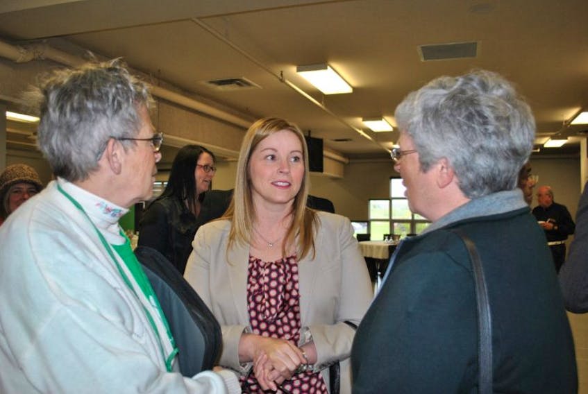 Karla MacFarlane speaks with people attending a Pictou County Chamber of Commerce function recently.