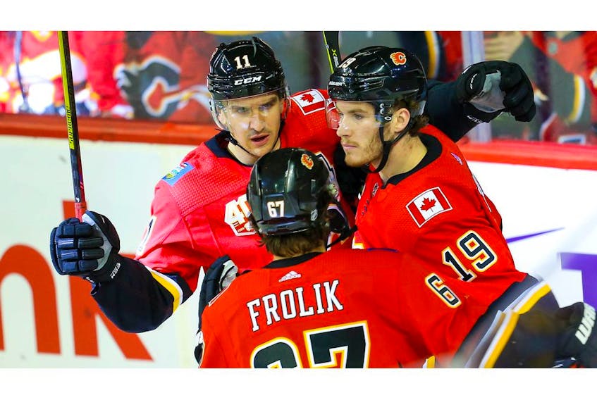 Calgary Flames Matthew Tkachuk celebrates with teammates after his goal against the Florida Panthers during NHL hockey in Calgary on Thursday October 24, 2019. Al Charest / Postmedia