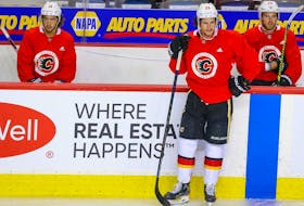 Calgary Flames’ winger Johnny Gaudreau, from left, is back skating with Sean Monahan and Elias Lindholm for the first time since NHL training camp returned after the coronavirus (COVID-19 strain) lock down. The Flames will take on Winnipeg Jets in 2020 Stanley Cup playoffs starting Aug. 1. 