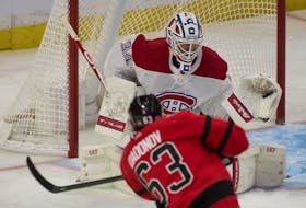 Montreal Canadiens goalie Jake Allen makes a save on a shot from Ottawa Senators forward Evgenii Dadonov in a recently game in Ottawa.   
