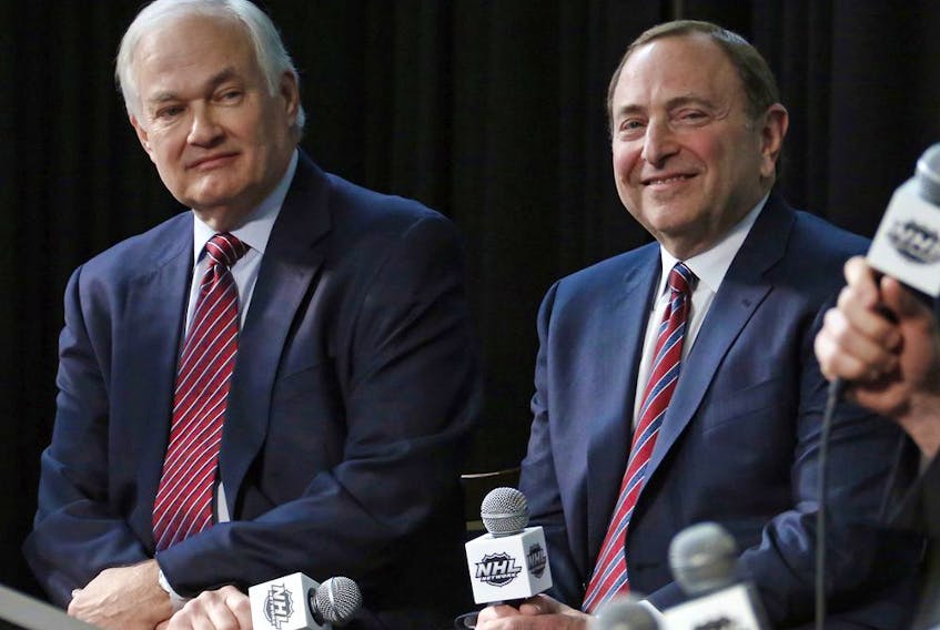 n this Jan. 24, 2015, file photo, NHL Player's Association executive director Donald Fehr, left, and NHL Commissioner Gary Bettman attend a news conference at Nationwide Arena in Columbus, Ohio. Given the gravity of the pandemic and the abrupt decision to place the NHL season on pause in March, it did not take Bettman and Fehr long to realize they were going to have to work together if play was to resume any time soon.