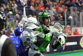 Saskatchewan Rush’s Matt Hossack eyes the loose ball as he fends off brother Graeme Hossack and Colton Armstrong of the Halifax Thunderbirds during National Lacrosse League action Saturday night at Scotiabank Centre.   ERIC WYNNE / The Chronicle Herald