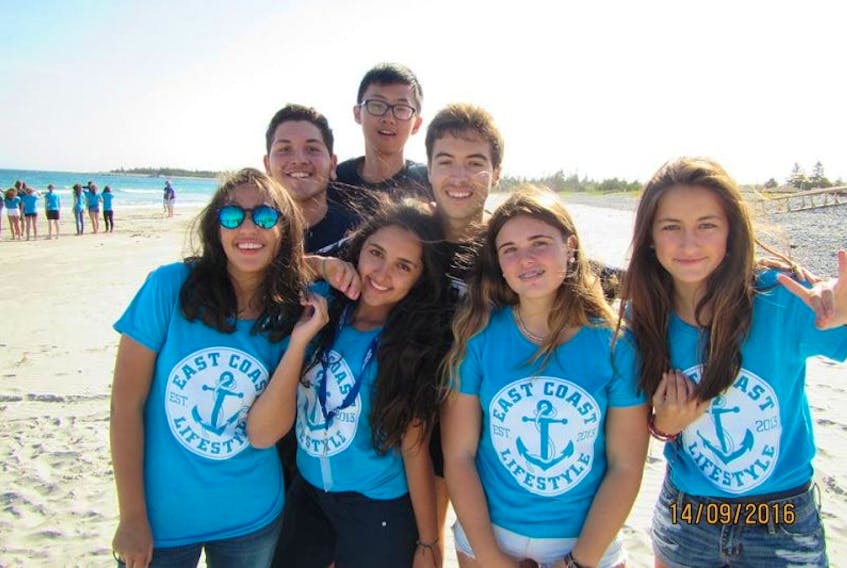 International students enjoy sun and sand on Queens County beaches last September. Host families are still needed for short-term stays next year.