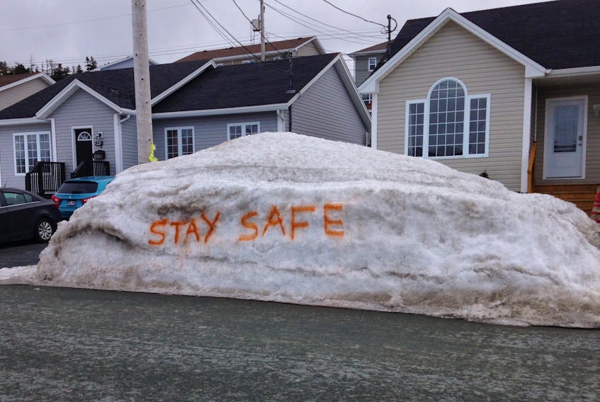 Snowmaggedon was months ago, but enough of its huge and sudden dumping of snow remains on the side of streets in early April to spray paint messages to passersby as the province deals with the current COVID-19 pandemic. "Stay Safe" is the message seen Sunday on this snowbank on Cameo Drive in Paradise. Glen Whiffen/The Telegram