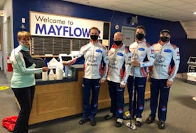 These masked men came away with the money Sunday in Halifax. Brad Gushue’s team from the Remax Centre (St. John’s Curling Club) won the Dave Jones Stanhope Simpson Insurance Cashspiel over the weekend at the Mayflower club. Gushue and teammates Mark Nichols, Brett Gallant and Joel Krats are shown accepting the $4,000 first-place prize. — Submitted photo

