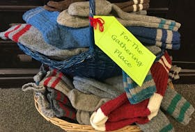 Wool socks from NONIA are bound for The Gathering Place after the annual pre-Christmas buy one, give one event. CONTRIBUTED PHOTO