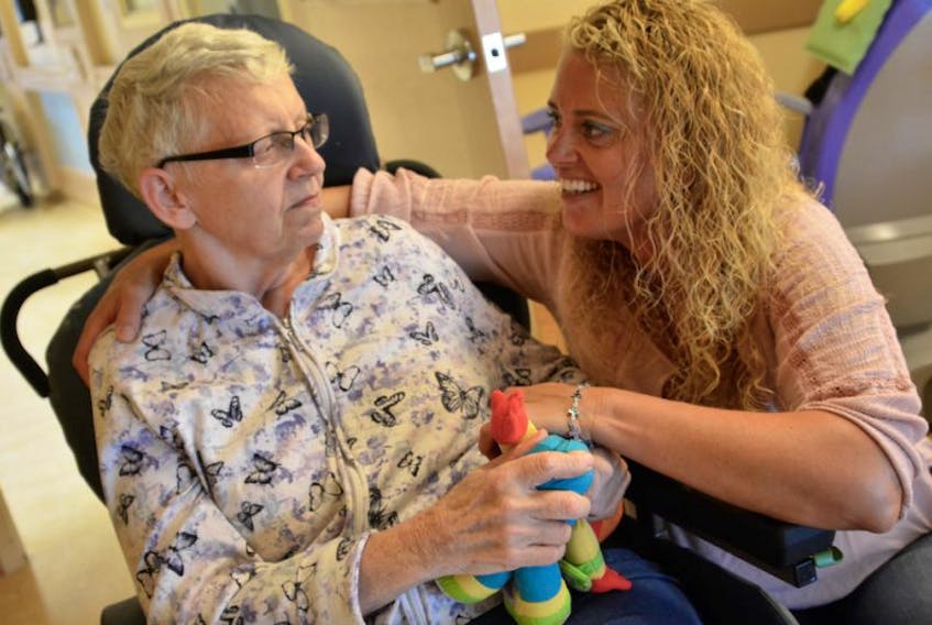 Tam MacPhee spends time with her mother Norma Tedford at the long-term care facility Norma lives in.