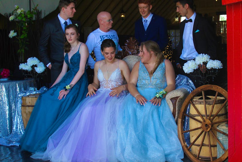 North Sydney-based photographer John Ratchford explains the first shot and positioning to a group of Riverview High School 2020 grads who booked one of his "prom experience" sessions. Pictured here are, back row from left, Adam Steylen, Ratchford, Chris Parsons and Mitchell Doucette. Front from from left are Tori Ranni, Madison MacInnis and Hailey Phillipo, who graduated in 2019 and was there as Doucette's date. NICOLE SULLIVAN/CAPE BRETON POST 