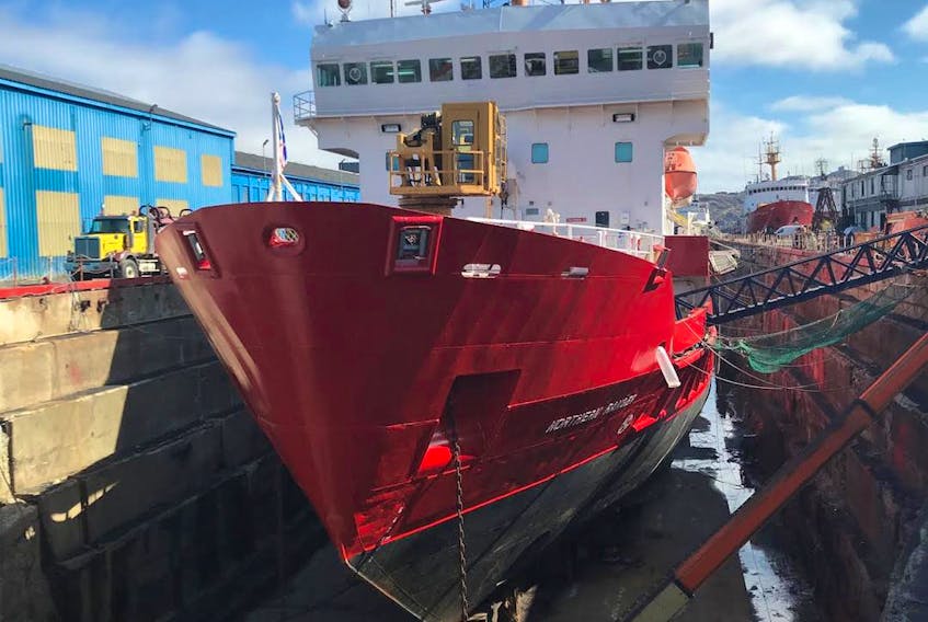 The Northern Ranger, shown here getting a new paint job, will be delivering freight to Natuashish starting again this month. - Courtesy of Dean Porter