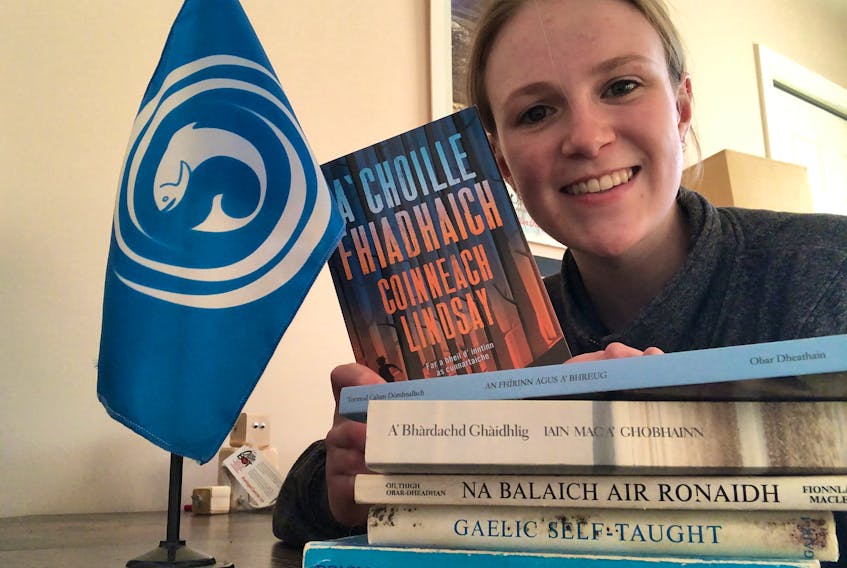 Emma Smith and a few of the Gaelic language novels she studied for her international baccalaureate languages requirement during the 2019-20 school year. Now in her first year at St. Francis Xavier University in Antigonish, Smith was the first student in the world to complete the course, which didn't exist before educator Lindsay MacInnis created it for students who study Gaelic in the Strait Regional Centre for Education schools. CONTRIBUTED 