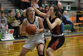 Avery McKinnon of the Breton Education Centre Bears, left, looks to shoot as she's watched by Maddie Long of the Northumberland Nighthawks during New Waterford Coal Bowl Classic action at the BEC gym last February. - Jeremy Fraser