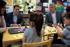 Education Minister Zach Churchill and Premier Stephen McNeil talk with students and staff prior to a pre-primary nnouncement at Chebucto Heights Elementary earlier this month. An expert in work sociology says these kinds of programs can help boost family incomes. - File