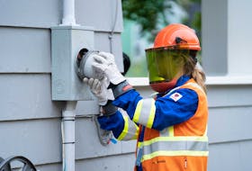 A Nova Scotia Power technician installs a smart meter at a customer's home. CONTRIBUTED • NOVA SCOTIA POWER 