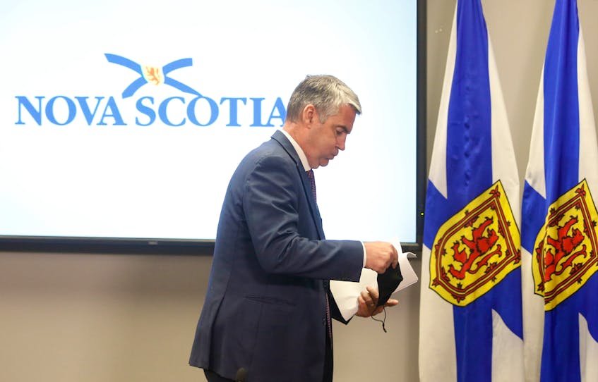 FOR RANKIN STORY:
Nova Scotia Premier Stephen McNeil looks to breathe a sigh of relief, as he walks from the podium and prepares to place on his mask after giving his notice of stepping down as the premier of the province, in Halifax Thursday August 6, 2020.

TIM KROCHAK PHOTO