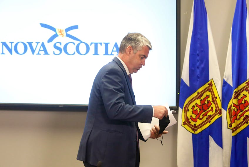 FOR RANKIN STORY:
Nova Scotia Premier Stephen McNeil looks to breathe a sigh of relief, as he walks from the podium and prepares to place on his mask after giving his notice of stepping down as the premier of the province, in Halifax Thursday August 6, 2020.

TIM KROCHAK PHOTO