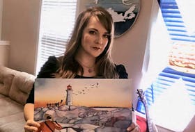 Donkin artist Beth Martin holds a copy of her painting Nova Scotia Strong, which she is selling as a fundraiser for the families of the victims of the Portapique tragedy. CONTRIBUTED