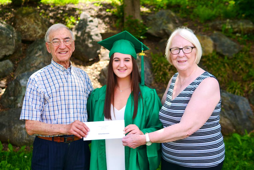 Molly Baxendale of Dalem Lake, who attended Memorial Composite High School in Sydney Mines, was recently presented with a $2,000 bursary for her post-secondary education by the Nova Scotians for Equalization Fairness group. Presenting the award was Rev. Albert Maroun, who is funding the fellowship program, and Martha Ross, who is administrator of the fellowship and bursary program. Baxendale has successfully completed two years in the fellowship and is the third student to enter the program. CONTRIBUTED