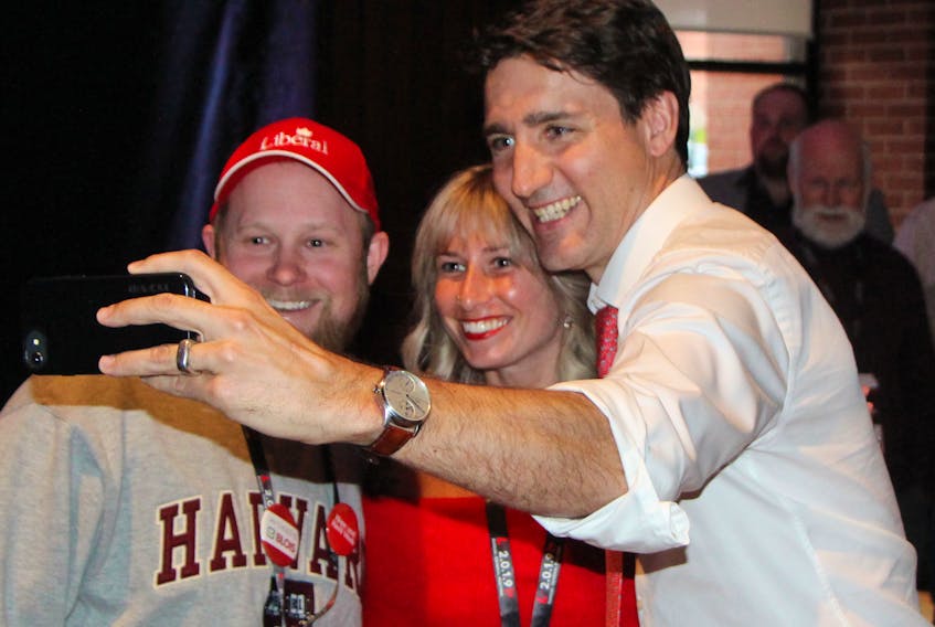 Evan (left) and Keltie Price take a 'selfie' with Prime Minister Justin Trudeau after he spoke to a partisan crowd on the St. F.X. campus in Antigonish during the opening ceremonies for the annual general meeting of the Liberal Party of Nova Scotia. Corey LeBlanc