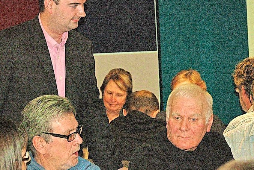 Business, Tourism, Culture and Rural Development minister Christopher Mitchelmore engages members of a round table pre-budget consultation discussion in St. Anthony on Feb. 2.